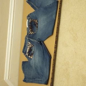 A awesome pair of Hydraulic blue  Jeans with rhinestones on the back of pocket.